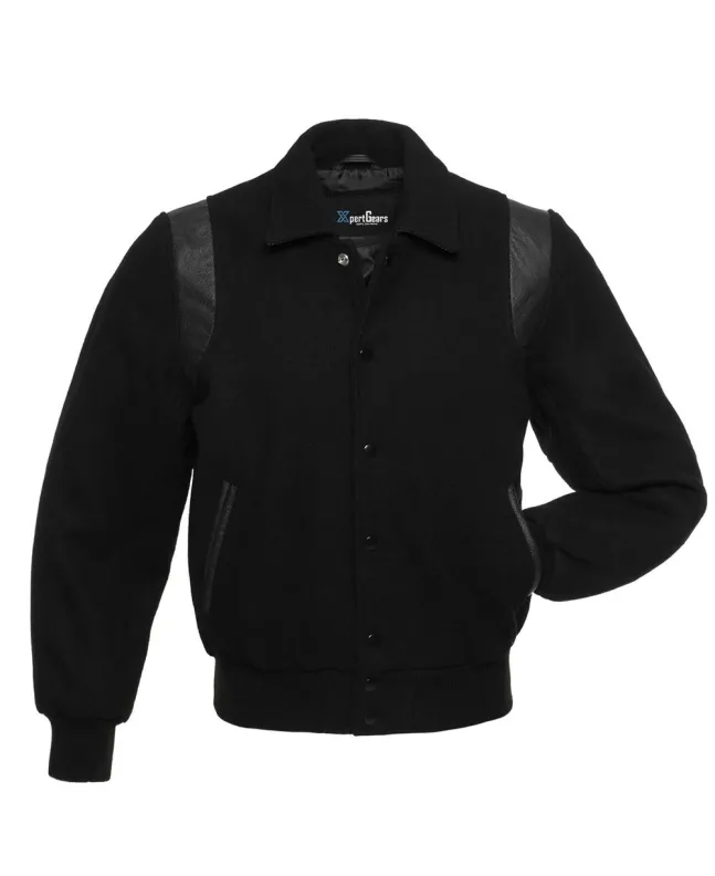 Front view of Black Retro Varsity Jacket featuring a retro collar, black wool body and sleeves, with seamless black leather shoulder inserts.