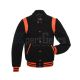 Front view of Black Retro Varsity Jacket featuring a retro collar, black wool body and sleeves, and vibrant orange leather shoulder inserts.